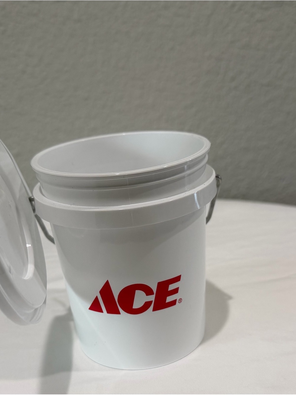 White Plastic Utility Bucket with Red Logo